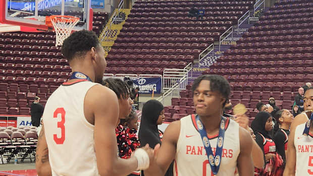 Justin Edwards (No. 3) and Ahmad Nowell (No.0) celebrate after Imhotep Charter won the 2023 Class 5A state championship